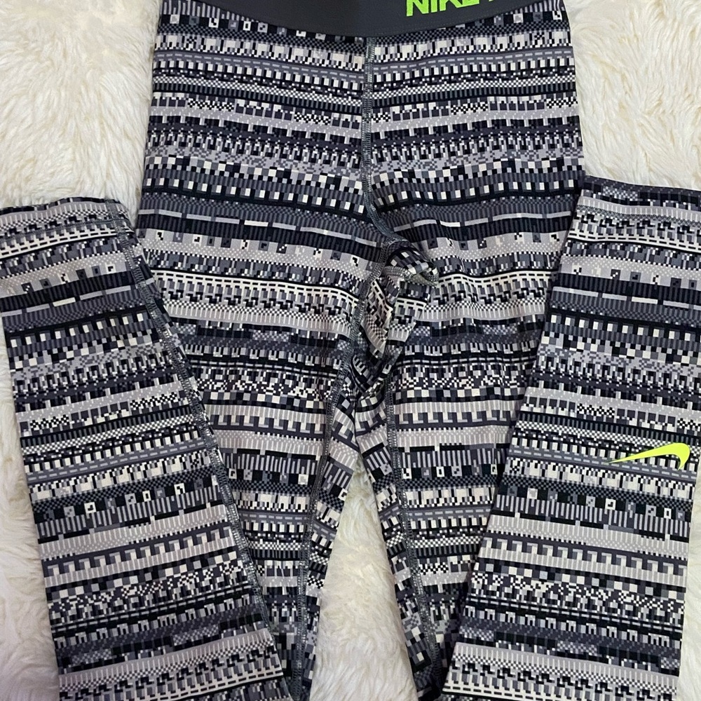 Nike gray, white, and neon yellow pixel like print with slight chafing on back
